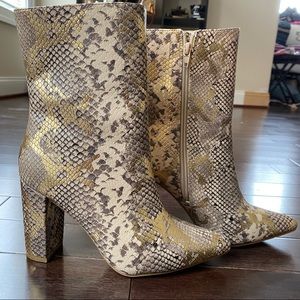 Snake Printed Pointed Heel booties.
